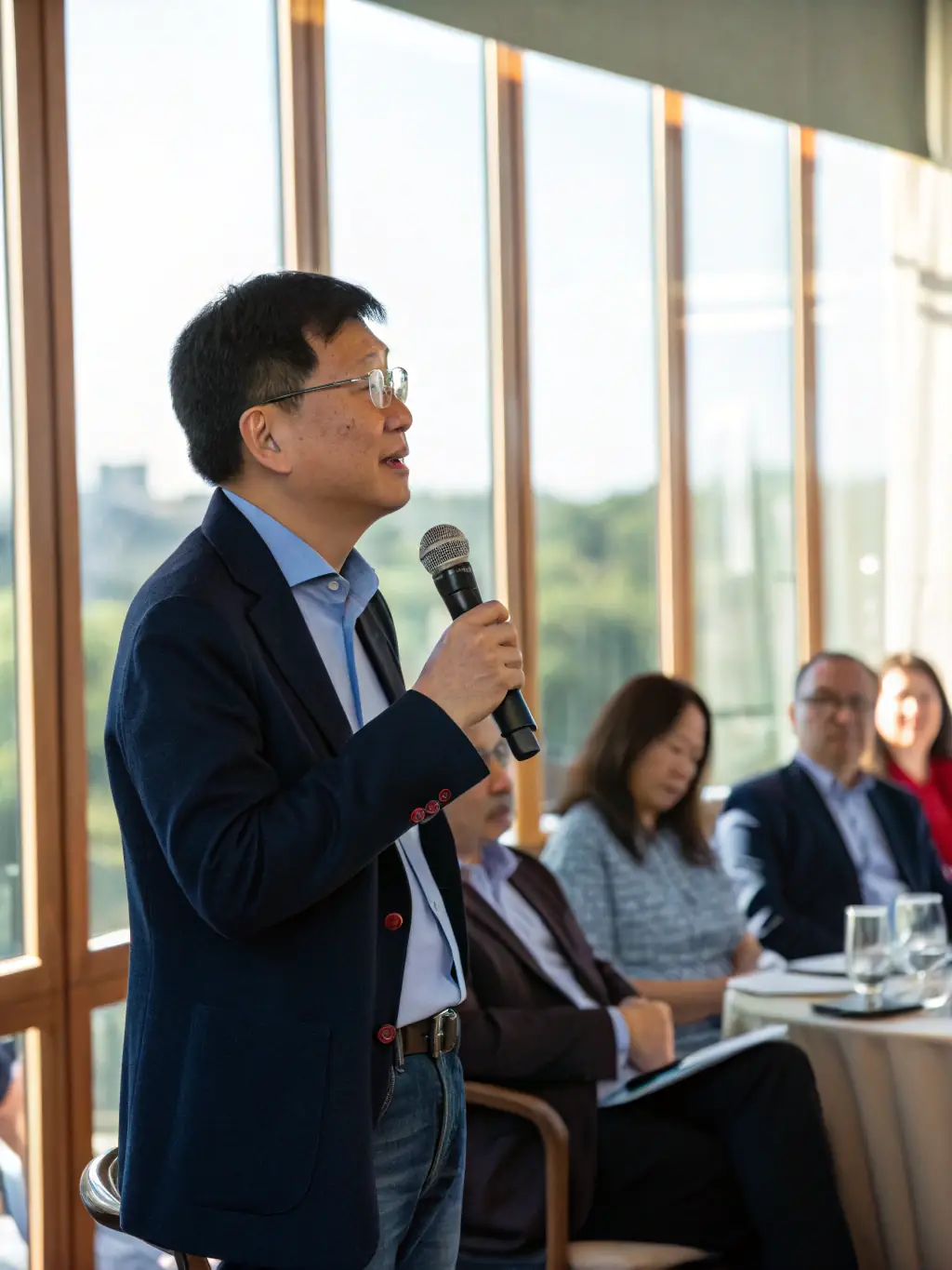 A compelling portrait of Mr. David O'Connell, a venture capitalist, participating in a panel discussion on startup funding at a ClearFactor conference in Edinburgh, showcasing his insightful commentary and investment expertise.