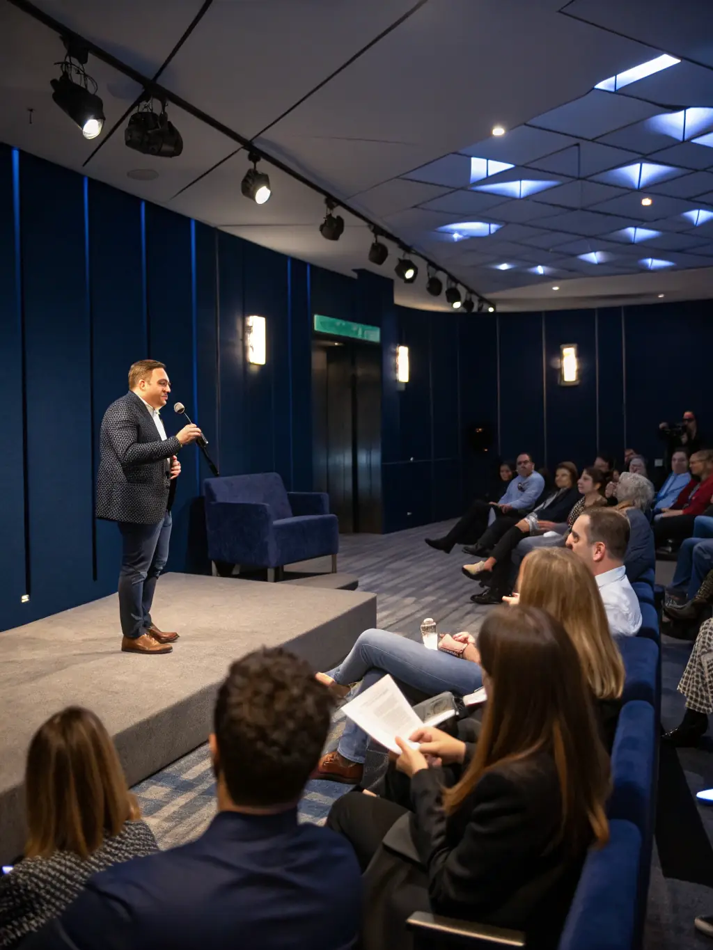 A dynamic photo capturing a keynote speaker passionately addressing a large audience at a recent Clearfactor startup conference in London, emphasizing engagement and inspiration.